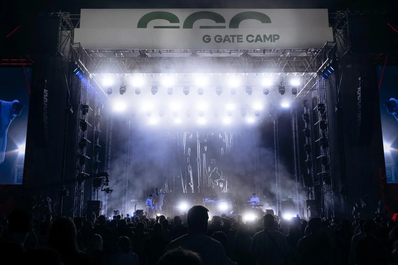 A brightly lit stage at an event with the